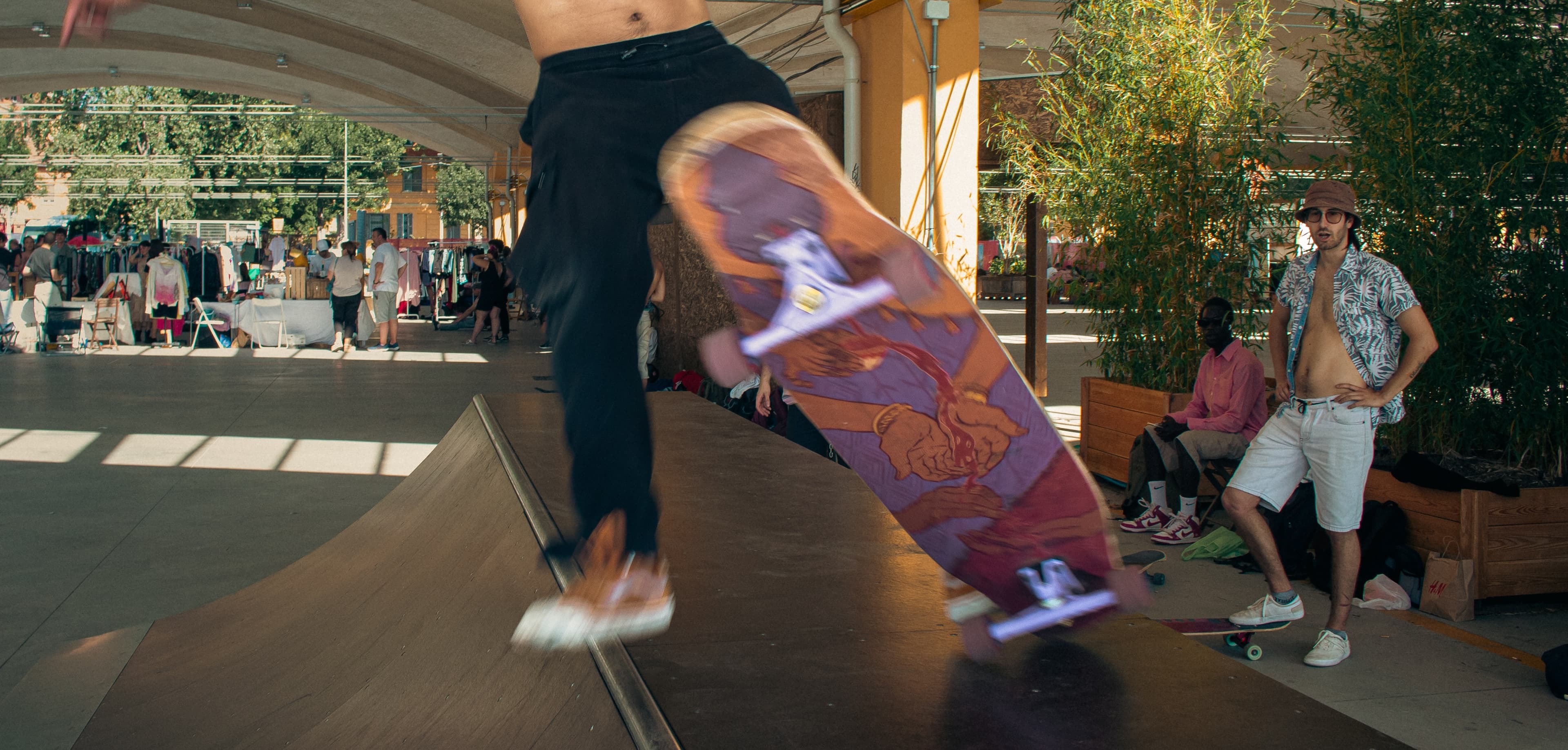 A skater performing a trick on the Spill the tea Longboard Design